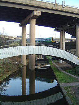 The Cross City Line and Tame Valley Canal passing underneath the motorway complex Canal at Gravelly Hill Interchange - 2009-03-19.jpg