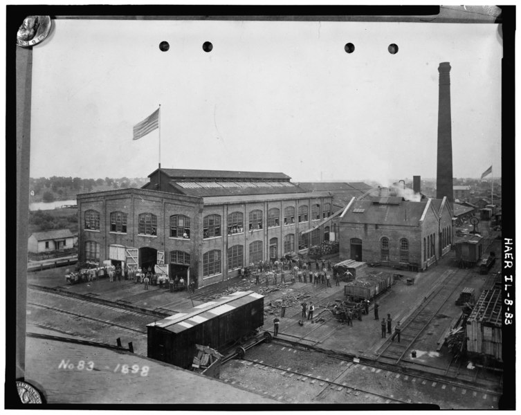 File:Car department, woodworking mill located on first floor of larger building, telegraph, cabinet and pattern shops on second floor, power plant is smaller structure, photograph HAER ILL,45-AUR,1-83.tif