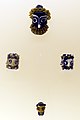 Carthage, corsair-headed pendants in glass paste, 510-250 BC ca.
