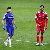 Lescott (right) playing for West Bromwich Albion in 2014 Chelsea 2 West Brom 0 The Blues go marching on. (15672988777).jpg