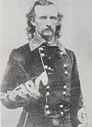 Custer's personalized uniform with Austrian knots, yellow piping and a non-regulation red fireman's shirt with a Brigadier-General's star embroidered on the collar points.