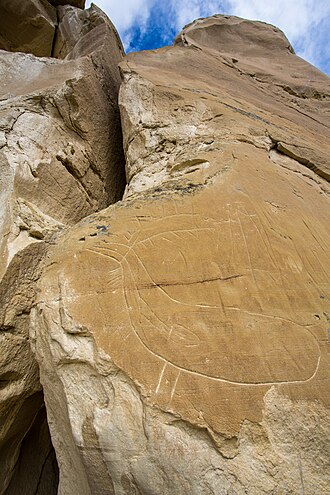 A petroglyph of a deer carved into Deer Medicine Rocks in Montana. Deer Medicine Rocks Deer Petroglyph.jpg