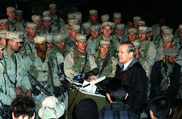 U.S. Secretary of Defense Donald Rumsfeld speaks to U.S. troops at Bagram on 16 December 2001.