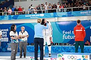 Deutsch: Fechten bei den Olympischen Jugend-Sommerspielen 2018: Tag 1, 7. Oktober 2018, Jungen, Säbel, Siegerehrung - Gold: Krisztián Rabb (HUN), Silber: Hyun Jun (KOR), Bronze: Mazen Elaraby (EGY); Medaillen überreicht durch IOC-Mitglied Britta Heidemann, Maskottchen überreicht durch FIE-Generalsekretär Emmanuel Katsiadakis English: Fencing at the 2018 Summer Youth Olympics at 7 October 2018 – Boys' sabre Medal ceremony – Gold: Krisztián Rabb (HUN), Silver: Hyun Jun (KOR), Bronze: Mazen Elaraby (EGY); Medal presenter: IOC member Britta Heidemann, Mascot presenter: FIE Secretary General Emmanuel Katsiadakis