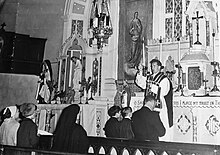 Father Eugene McCabe celebrates mass at the splendid pre-Vatican II high altar, Ss. Peter & Paul Church, Magheracloone FrEugeneMcCabe.jpg