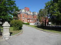 The Franco American School; southeast (front) and northeast sides of building shown. Located at 357 Pawtucket Street, Lowell, Massachusetts.