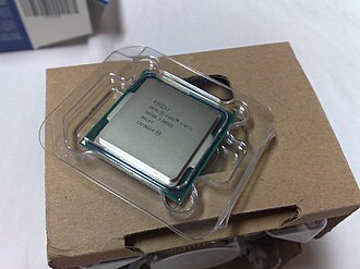 Intel Haswell Core i7-4771 CPU, sitting atop its original packaging that contains an OEM fan-cooled heatsink Intel Haswell 4771 CPU.jpg