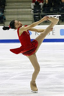 Kaori Sakamoto of Japan performing an upright spin. Junior World Championships 2015 (Kaori SAKAMOTO JPN - 6th Place) (20).jpg