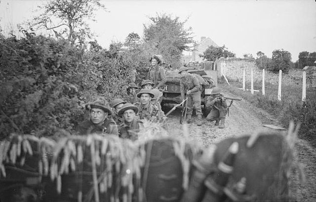 Troops of 4th battalion Dorsetshire regiment C company sheltering from mortar fire during Operation Jupiter, 10 July 1944.