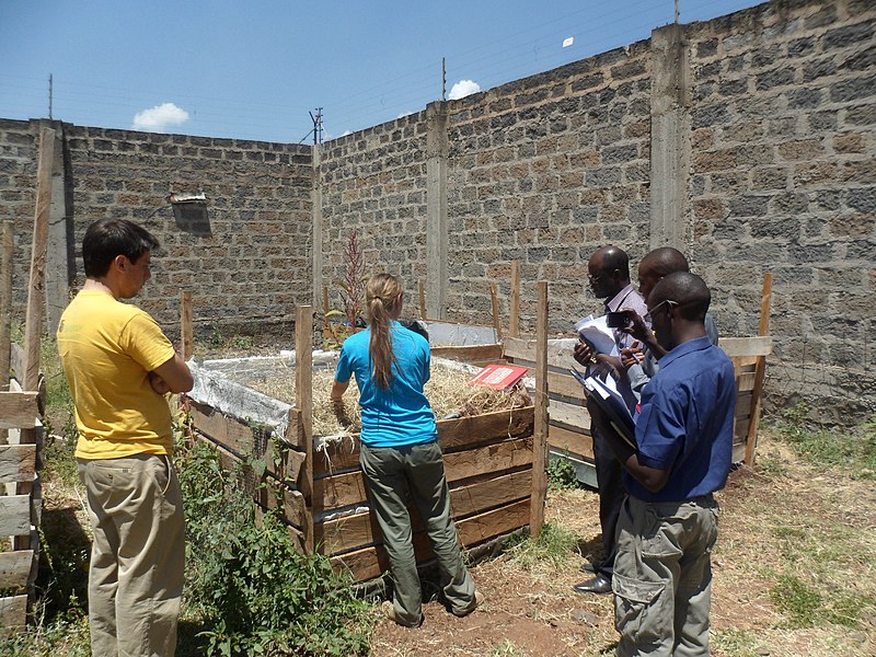 File:Laura showing us the containers for composting of faeces and saw dust (6879704533).jpg