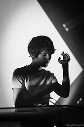 Madeon (pictured in 2015) and Passion Pit collaborated for the single "Pay No Mind", which appeared on Madeon's 2015 debut studio album Adventure. Madeon (16471256023).jpg