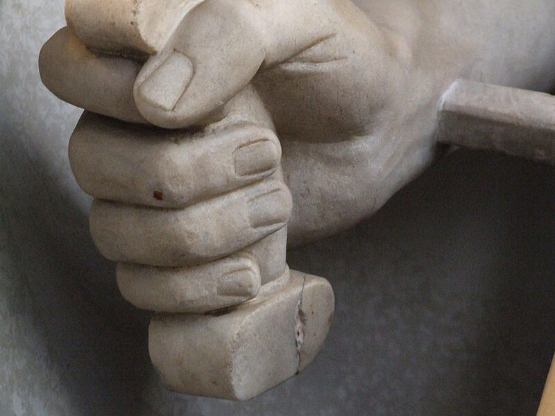 File:Marble statue - hand holding a sword hilt, closeup - Commons by gnuckx (11640341545).jpg