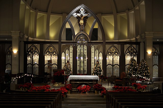 Midnight Mass is held in many Christian churches toward the end of Christmas Eve, often with dim lighting and traditional decorative accents such as g