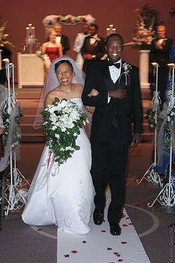 A Filipina bride and Nigerian groom walk down the aisle. Mixed-couple.jpg