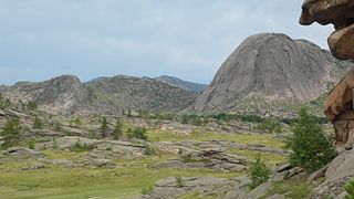 Granite dome Rounded hills of bare granite formed by exfoliation