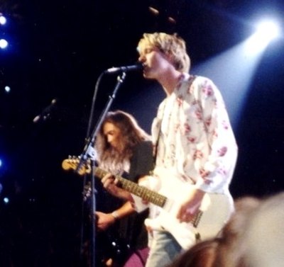 Nirvana performing live at the 1992 MTV Video Music Awards. Kurt Cobain is in the foreground and Krist Novoselic is in the background.