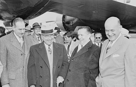 President Truman with Secretary of State Dean Acheson (left) and Secretary of Defense Louis A. Johnson (far right)