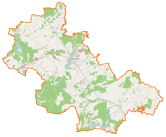 Mapa konturowa powiatu wolsztyńskiego, blisko centrum na lewo znajduje się punkt z opisem „Dawne opactwo cysterskiew Obrze”