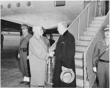President Truman shakes hands with Secretary of State George Marshall as Secretary Marshall is about to leave on an airplane to attend the London Conference of Foreign Ministers. They are at National Airport in Washington, D. C. President Truman shakes hands with Secretary of State George Marshall as Secretary Marshall is about to leave on an... - NARA - 199676.jpg