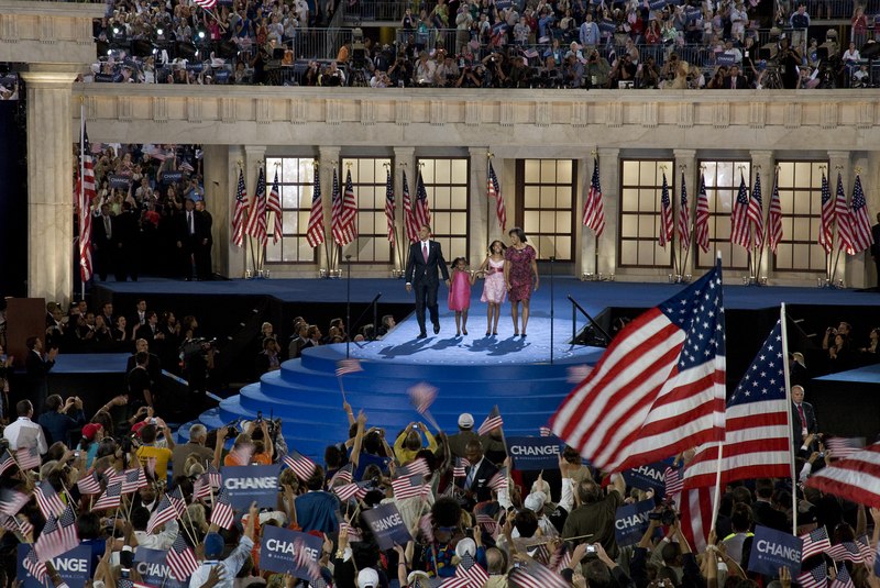 Presidential candidate Barack Obama, his wife Michelle, and his children Malia and Sasha wave to the audience at the Democratic National Convention, Denver, Colorado, August 25-28, 2008 LCCN2010719320