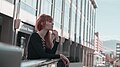 Red-headed woman at a railing (Unsplash).jpg