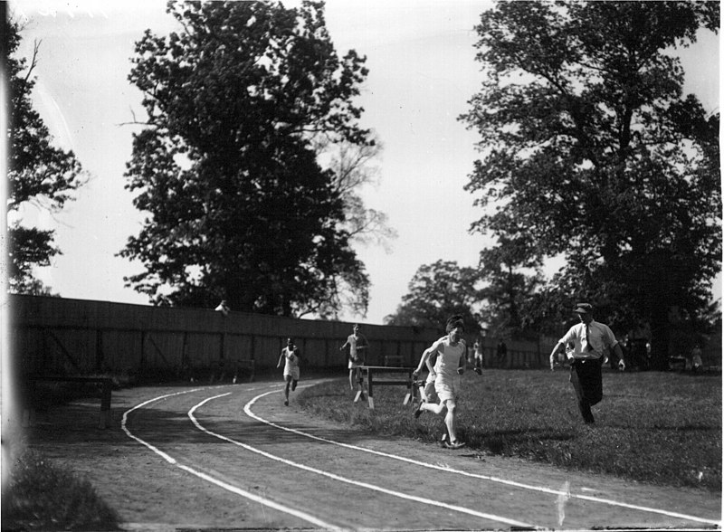 File:Runners on track with judge at high school track meet 1912 (3191298613).jpg