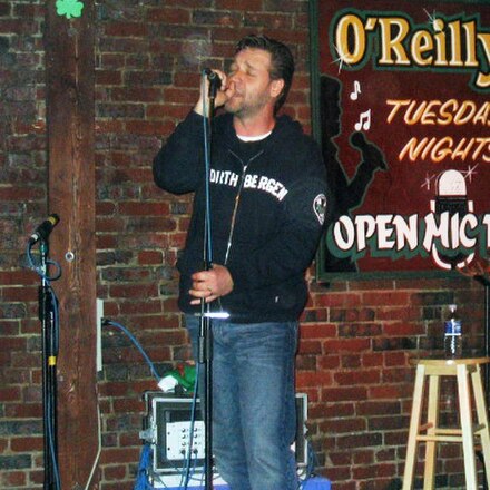 Crowe singing at an open mic night at O'Reilly's Pub in St. John's, Newfoundland and Labrador, Canada, 13 June 2005