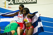 Mabel Gay (left) and Yargelis Savigne won medals for Cuba in the jumps. Savigne, Gay Berlin 2009.jpg