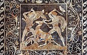 The Hellenistic mosaic of Pella's Deer Hunt, surrounded by floral rinceaux, 4th century BC