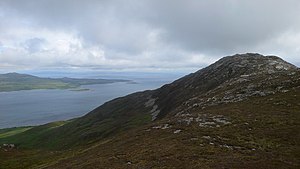 Summit of Sgorr nam Faoileann with the neighboring island of Jura in the background