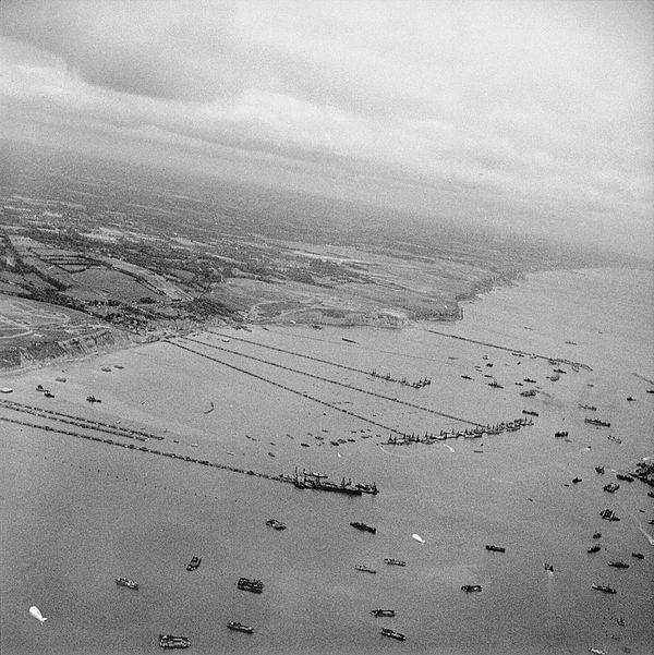 View of the Mulberry B harbour "Port Winston" at Arromanches in September 1944. Centre and left are "Spud" pierheads with floating piers of "Whales" a