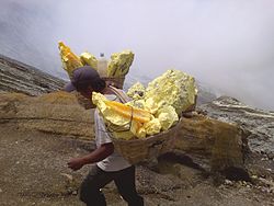 The sulfur miner of Kawah Ijen Mountain, Indonesia.jpg