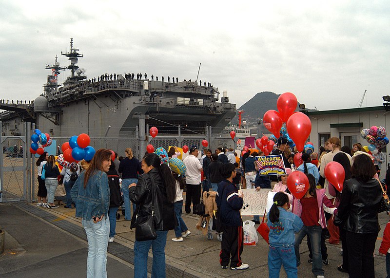 File:US Navy 050406-N-2716P-006 Friends and family await their Sailors and Marines to disembark at the homecoming celebration of the amphibious assault ship USS Essex (LHD 2).jpg