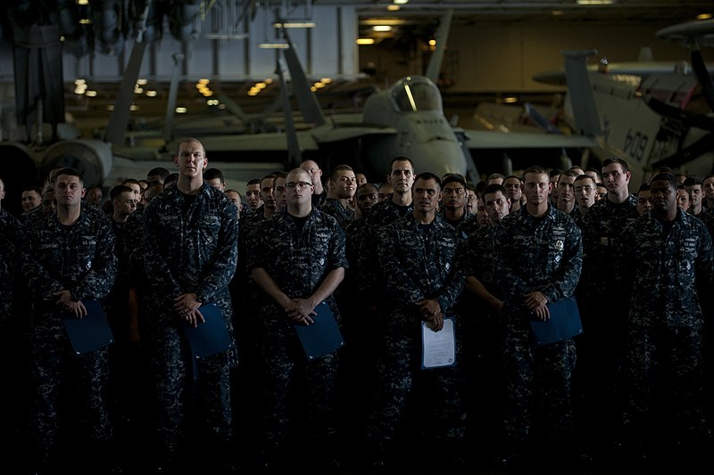 File:US Navy 111213-N-DR144-938 Newly promoted petty officers wait with their frocking letters.jpg