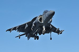 US Navy 120119-N-UM734-428 An AV-8B Harrier from Marine Attack Squadron (VMA) 542 flies over the amphibious assault ship USS Kearsarge (LHD 3).jpg