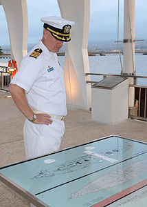 US Navy 120126-N-CO162-006 Capt. Pete Hildreth, commanding officer of the submarine tender USS Frank Cable (AS 40), looks over the schematics of th.jpg