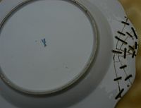 Underside of a Meissen plate, with c.C19th staples.jpg