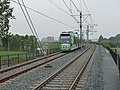 A tram approaching Van Tuyllpark