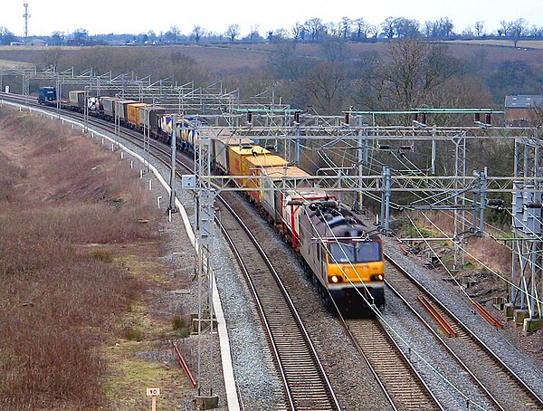 A container-goods train on the West Coast Main Line near Nuneaton, England