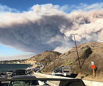 The smoke plume from the Woolsey Fire, seen from the Pacific Coast Highway Woolsey Fire evacuation from Malibu on November 9, 2018.jpg