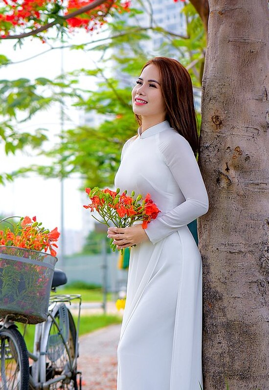 A woman wearing white Áo dài, May 2021
