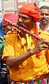 Adivasi men with flute at village fair