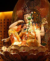 Statue of Ruyilun Guanyin (Cintamanicakra) in the Buddha Tooth Relic Temple and Museum in Chinatown, Singapore.