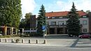 Wandlitzsee station with reception building, rows of shops, car hall, petrol station and pergolas