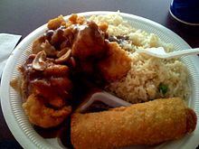 An American Chinese cuisine combination meal, consisting of cashew chicken, fried rice, and an egg roll Cashew Chicken Springfield.jpg