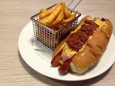 A chili dog with fries