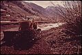 DREDGING GRAVEL FROM THE SAN MIGUEL RIVER FOR A NEW HOUSING DEVELOPMENT - NARA - 543760.jpg