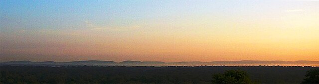 Silhouette of the Dângrêk Mountains, looking north from Cambodia at dawn.