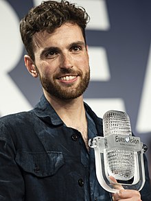 Duncan Laurence, who competed on the fifth season of singing competition show The Voice of Holland in 2014, with the trophy for winning the Eurovision Song Contest 2019. Duncan Laurence with the 2019 Eurovision Trophy (cropped).jpg