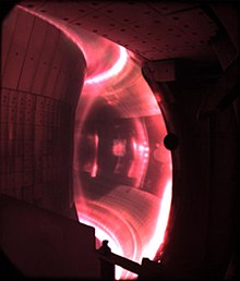 Red plasma in EAST, with visible light radiation dominated by the hydrogen alpha line emitting 656 nm light. EAST Tokamak plasma image3.jpg